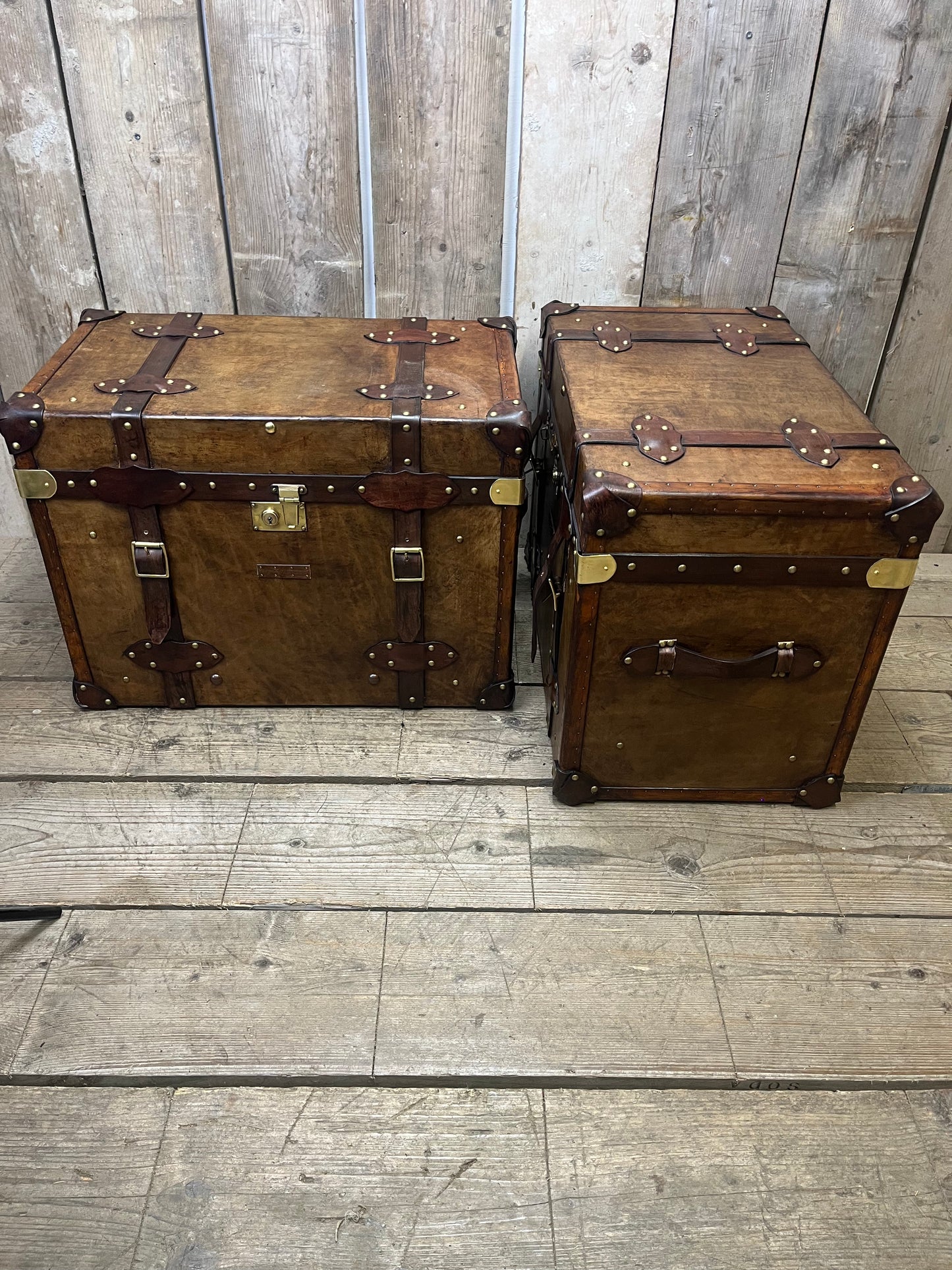 Pair Of Belted Leather Trunks